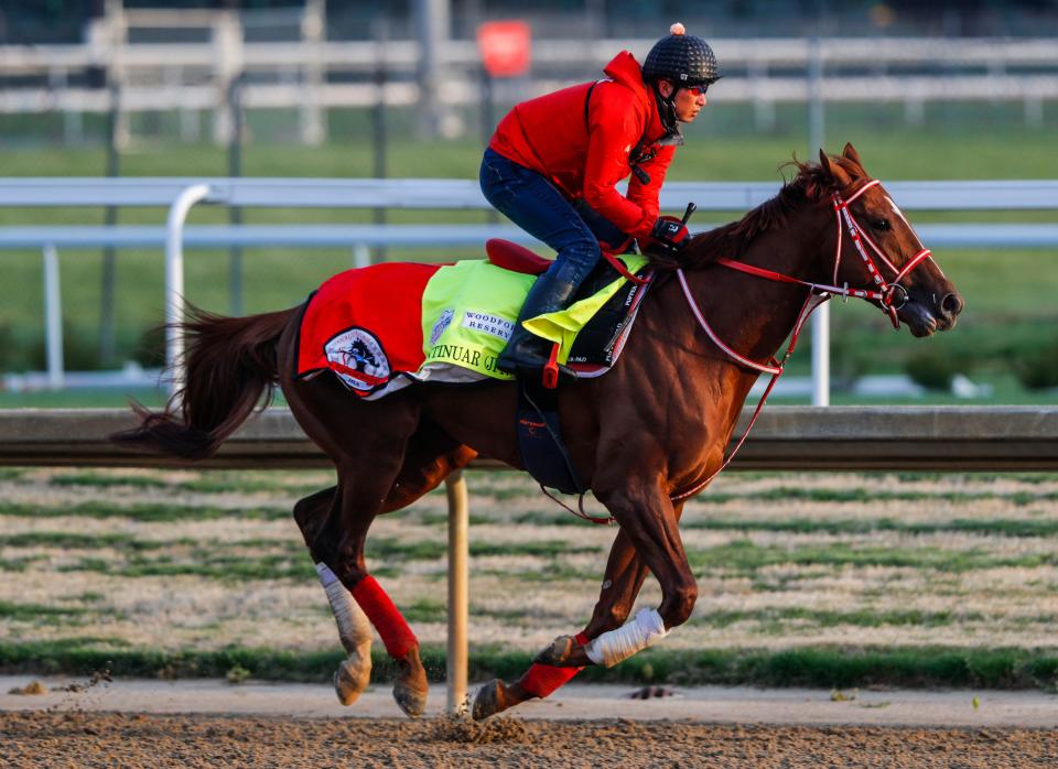 Assistant trainer Takahide Ando rides Continuar during an April 25 workout at Churchill Downs.