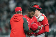 Cincinnati Reds starting pitcher Reiver Sanmartin (52) leaves the field after being relieved in the third inning of a baseball game against the Atlanta Braves Friday, April 8, 2022, in Atlanta. (AP Photo/John Bazemore)
