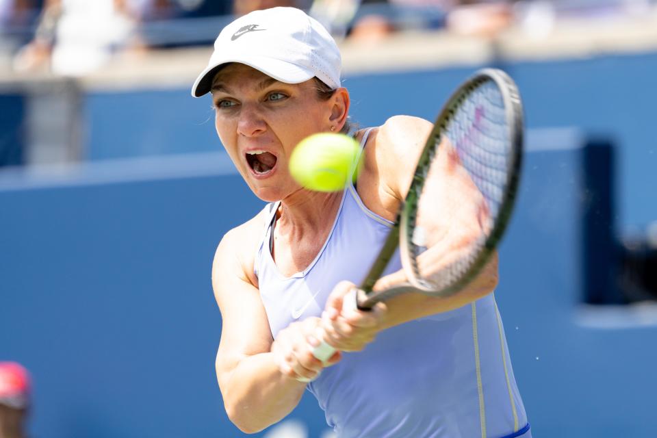 Pictured here, Simona Halep returns the ball against Beatriz Haddad Maia in the final of the Canadian Open.