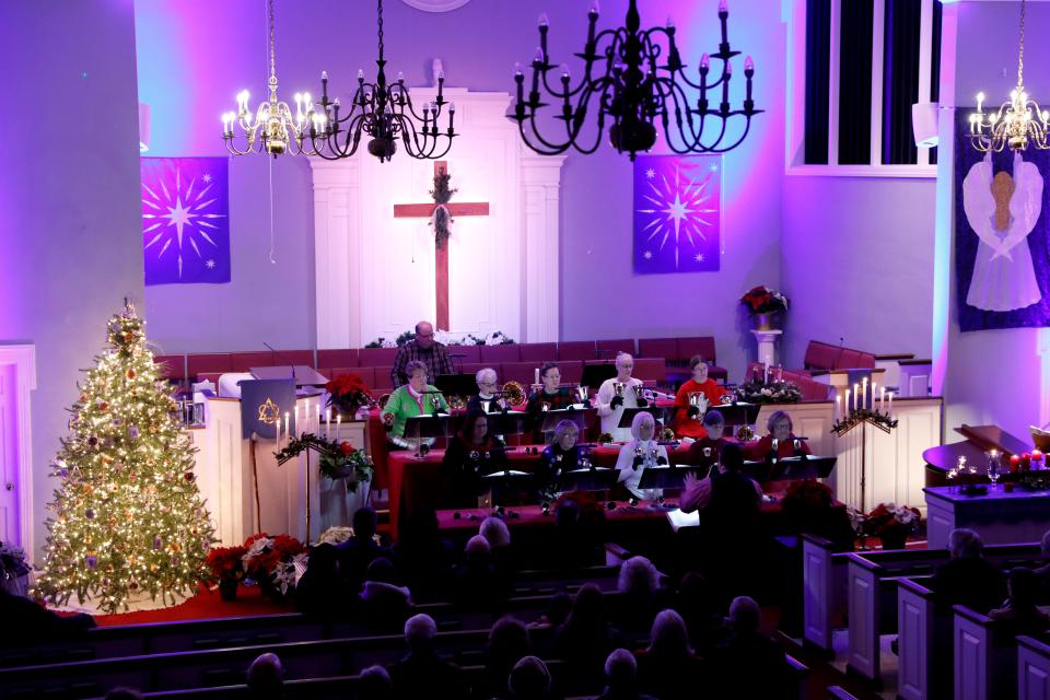 The First Presbyterian Church Celebration Ringers hand bell choir perform Saturday night, Dec. 14 2019, at the church in downtown Lancaster. The performance was part of Fairfield Heritage Association's 41st annual Candlelight Tour. Hundreds of people walked between seven different churches to hear musical performances.