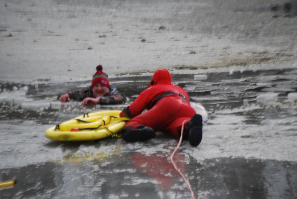 A man is rescued from Carousel Park pond on Friday.