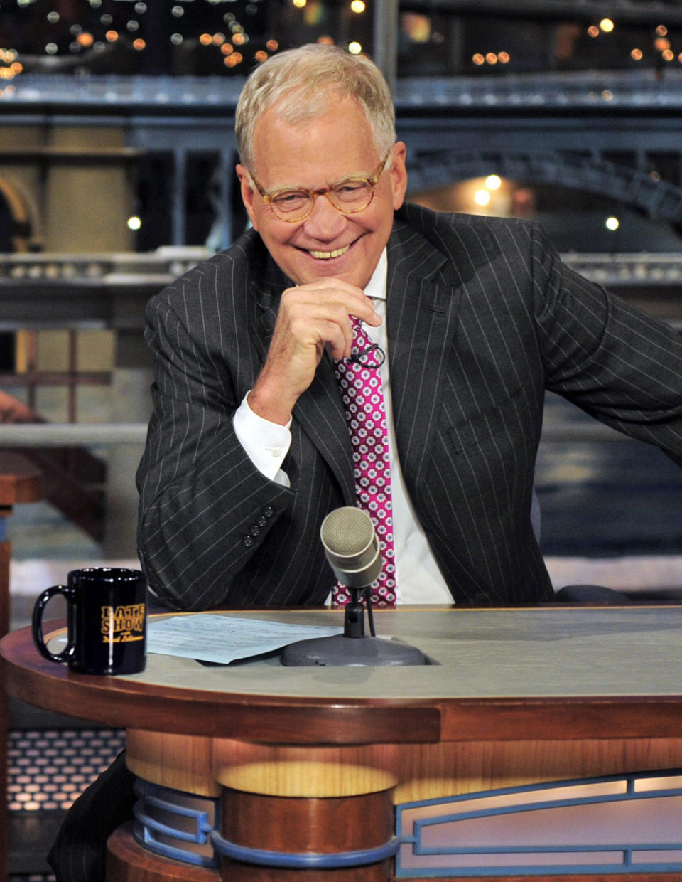 FILE - In this April 23, 2012 file photo provided by CBS, host David Letterman appears during a taping of his show “Late Show with David Letterman, in New York. Letterman says he plans to retire next year as host of “Late Show.” During a taping of his show Thursday, April 3, 2014, Letterman said he has informed his CBS bosses that he will step down in 2015, when his current contract expires. He told his audience he expects his departure will be “at least a year or so” from now. (AP Photo/CBS, John Paul Filo) MANDATORY CREDIT; NO ARCHIVE; NO SALES; NORTH AMERICAN USE ONLY