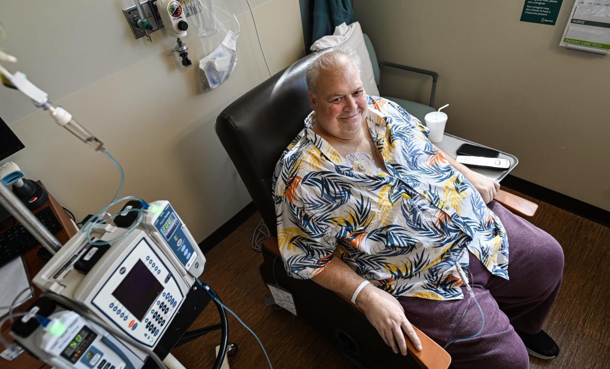 "I smile because I know people care and are rallying for me. It makes me want to fight this even more," Kevin Cronin, 61, of Holt says Wednesday, Oct. 18, 2023, during a chemotherapy infusion treatment at Sparrow's Herbert-Herman Cancer Center in Lansing.