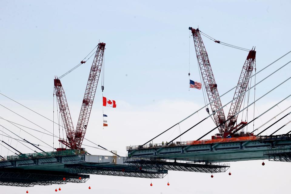 Cranes on the Canadian and U.S. sides work to help build the Gordie Howe Bridge in Detroit on Tuesday, May 14, 2024. The bridge is in the final steps of connecting the two sides, with only 85 feet remaining. The connection should be completed by the end of June.