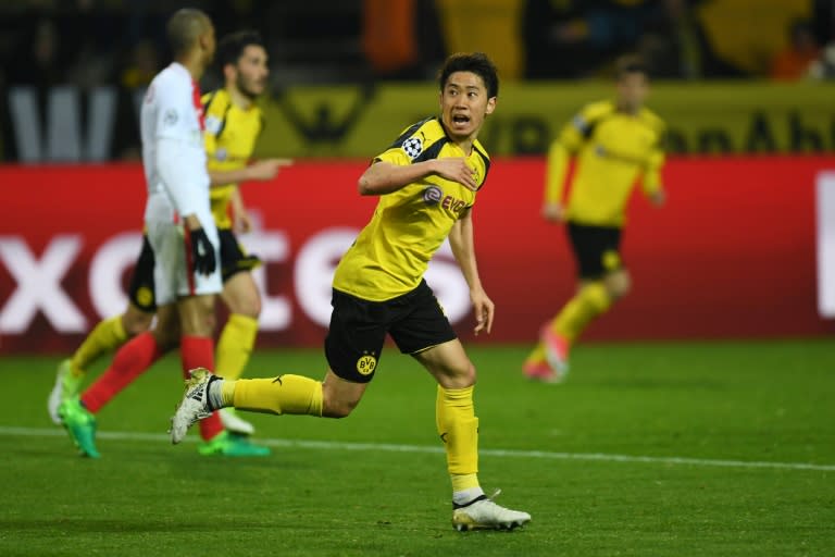 Dortmund's Shinji Kagawa celebrates after scoring a goal during their UEFA Champions League quarter-final 1st leg match against Monaco, in Dortmund, on April 12, 2017