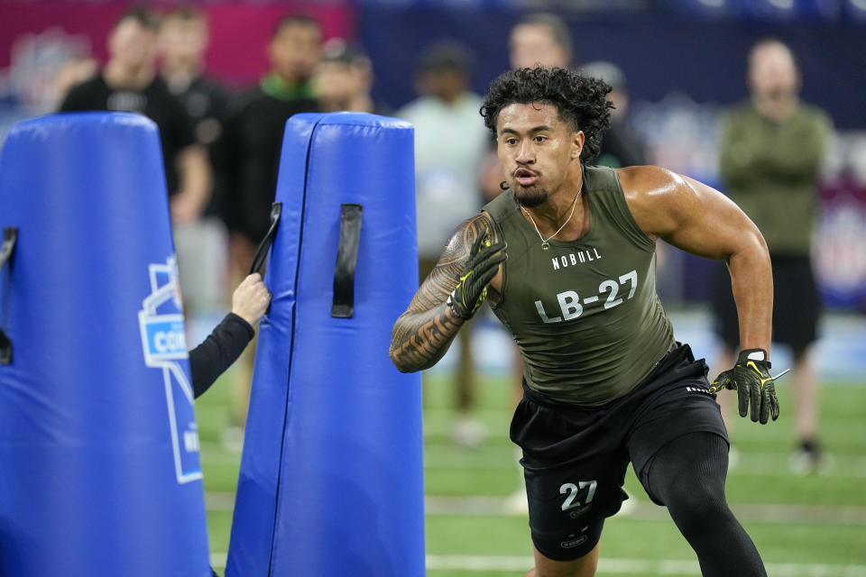 Oregon linebacker Noah Sewell runs a drill at the NFL football scouting combine in Indianapolis, Thursday, March 2, 2023. (AP Photo/Darron Cummings)