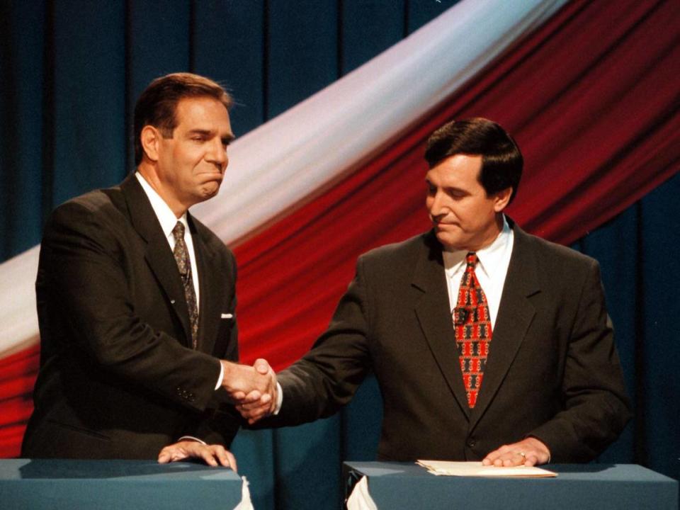 Miami mayoral candidates Xavier Suarez, left, and Joe Carollo shake hands in a photo dated Oct. 24, 1997.