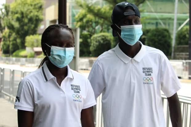 Rose Nathike Lokonyen, left, and James Nyang Chiengjiek, right, track athletes on the Refugee Olympic Team, are among three athletes competing at Tokyo 2020 before being resettled in Canada.  (Stephanie Jenzer/CBC - image credit)