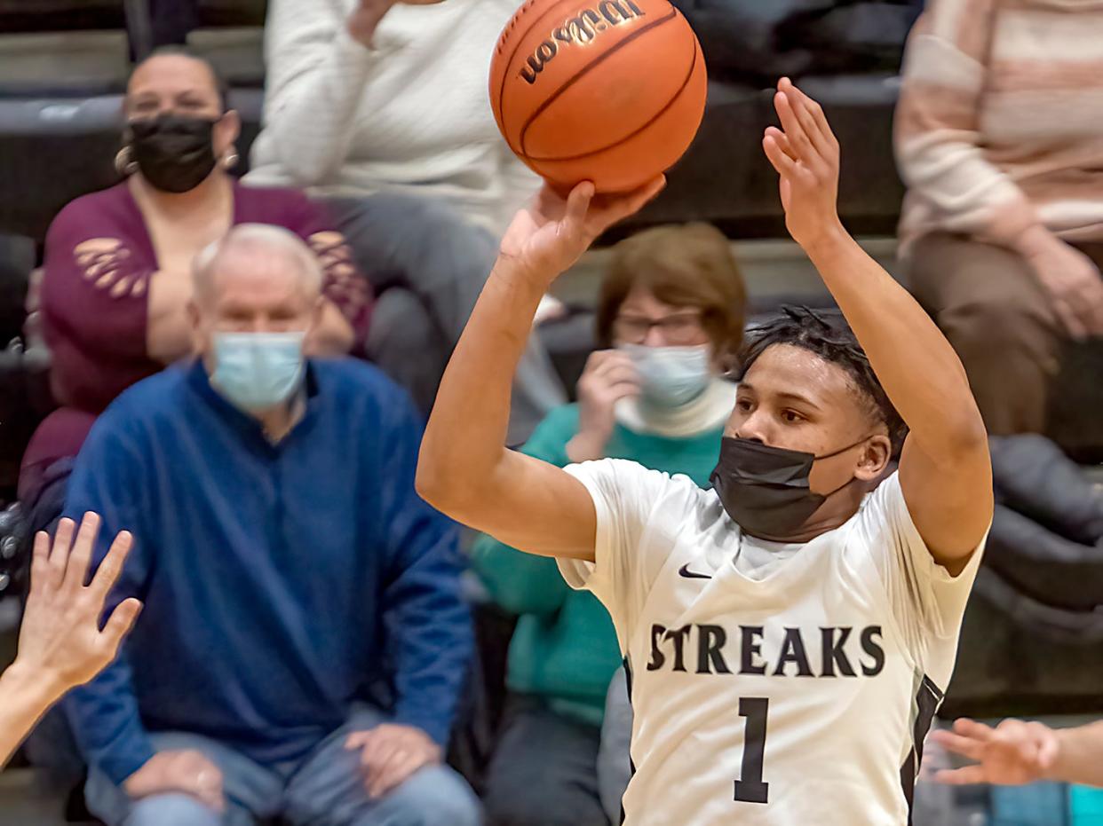 Galesburg High School senior guard Jeremiah Babers rises for a jump shot during the Silver Streaks' 73-48 WB6 Conference win over Sterling on Tuesday, Jan. 25, at John Thiel Gymnasium.