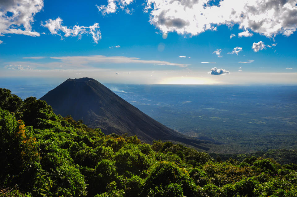 A volcano surrounded by forest in El Salvador.