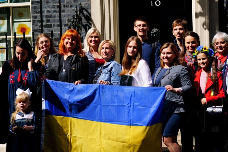 A number of Ukrainian families stand on the doorstep of 10 Downing Street after meeting Prime Minister Boris Johnson (Victoria Jones/PA) (PA Wire)