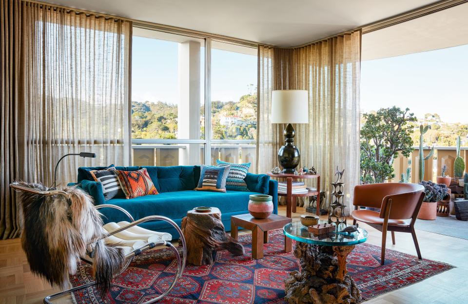 Cocktail tables from JF Chen and the Window gather in the living room. Commune for George Smith sofa; on Mies van der Rohe for Knoll lounge chair, throw by Grand Splendid; linen curtains by Pindler.