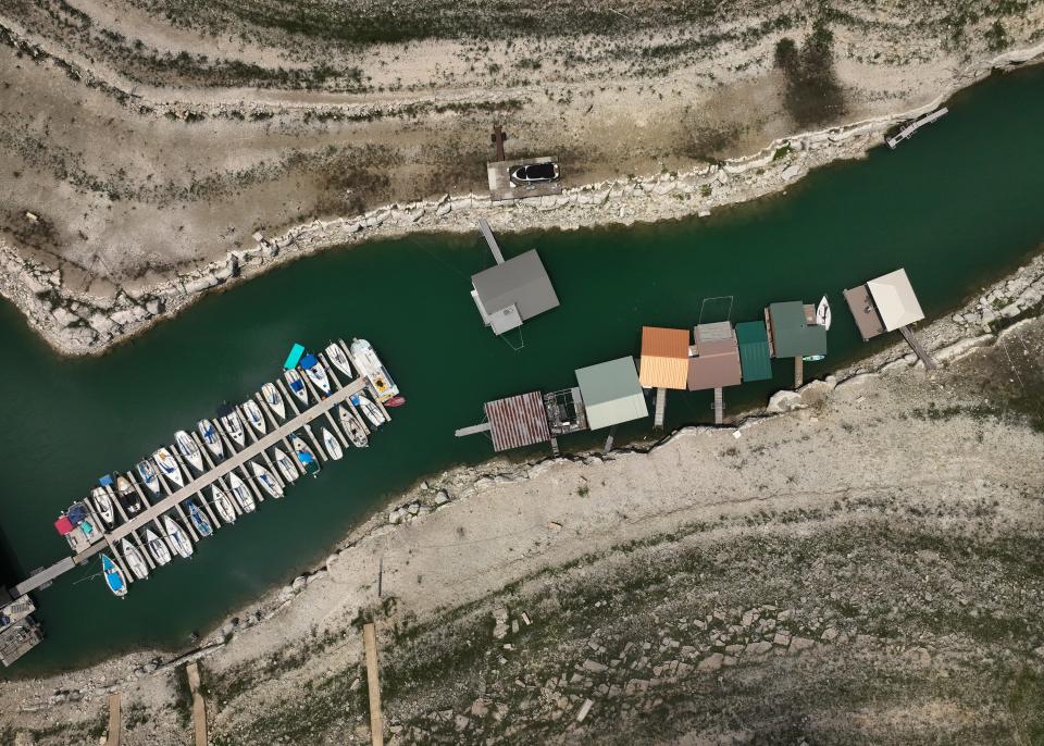 Boats are docked Monday in a dwindling inlet at Volente on Lake Travis, which is only 38% full.