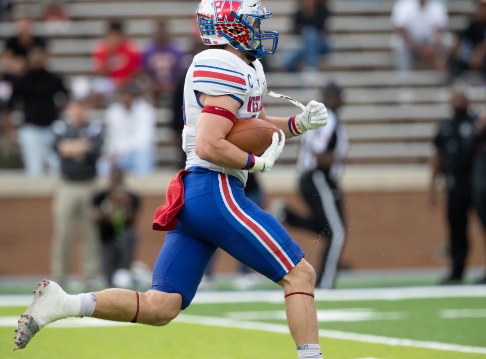 Westlake senior Bryce Chambers scores a touchdown during North Shore's 49-34 win in the Class 6A Division I state semifinal at Rice Stadium in Houston on Dec. 10. The loss snapped a 54-game winning streak for Westlake, which was trying to reach a fourth consecutive state title game.