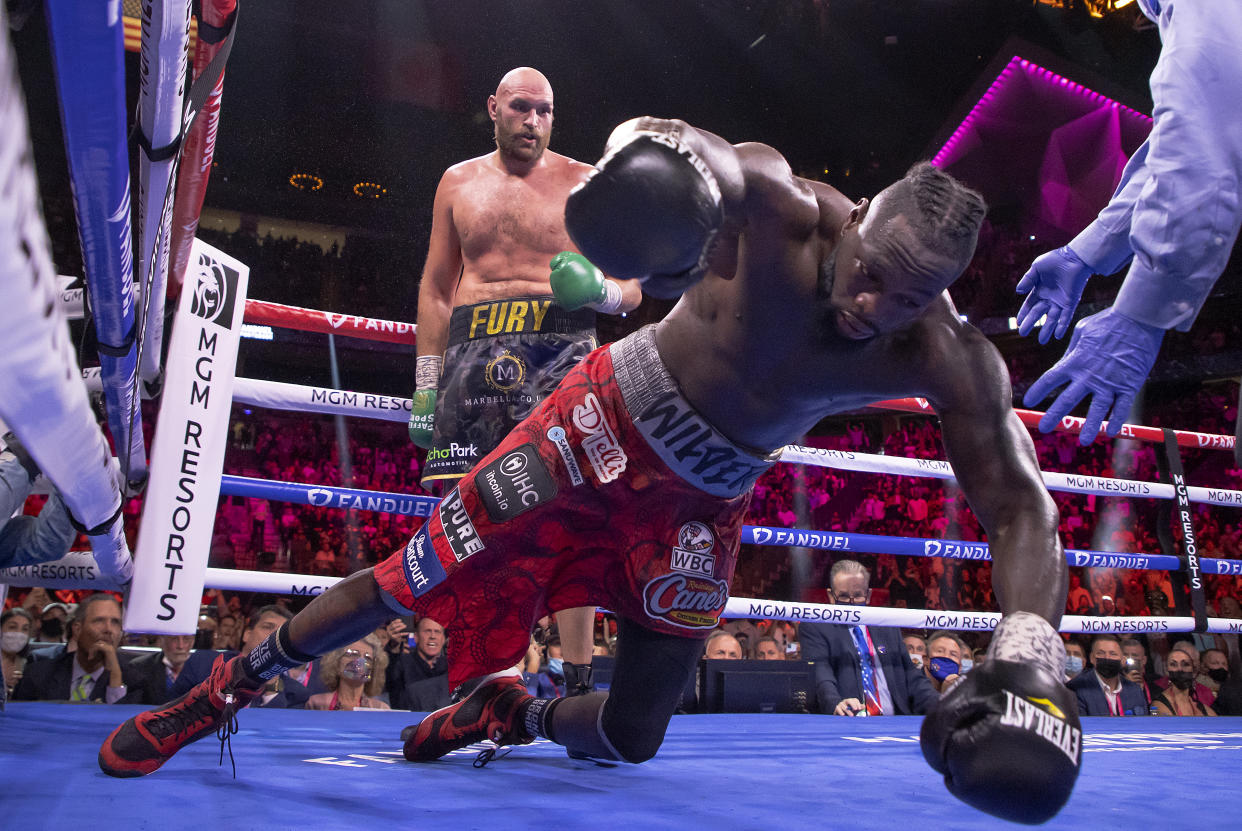 LAS VEGAS, NEVADA - OCTOBER 09:  Deontay Wilder (R) is knocked out by Tyson Fury in the 11th round during their WBC heavyweight title fight at T-Mobile Arena on October 09, 2021 in Las Vegas, Nevada.  (Photo by Al Bello/Getty Images)