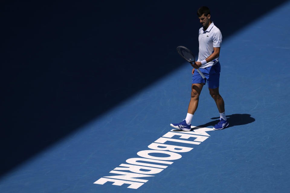 Novak Djokovic of Serbia reacts during his semifinal against Jannik Sinner of Italy at the Australian Open tennis championships at Melbourne Park, Melbourne, Australia, Friday, Jan. 26, 2024. (AP Photo/Alessandra Tarantino)