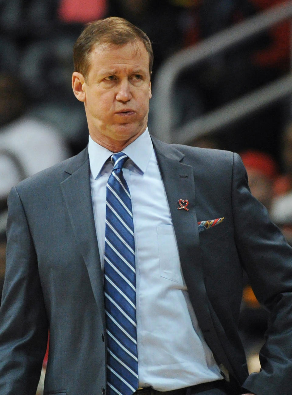 Portland Trail Blazers head coach Terry Stotts puffs out his cheeks when the Atlanta Hawks score in the first half of their NBA basketball game Thursday, March 27, 2014, in Atlanta. (AP Photo/David Tulis)