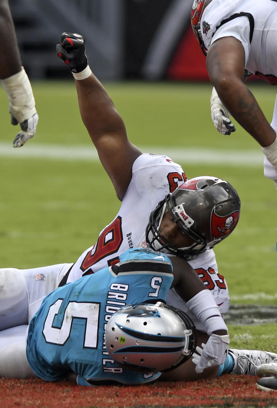 Tampa Bay Buccaneers nose tackle Ndamukong Suh (93) celebrates after sacking Carolina Panthers quarterback Teddy Bridgewater (5) during the second half of an NFL football game Sunday, Sept. 20, 2020, in Tampa, Fla. (AP Photo/Jason Behnken)