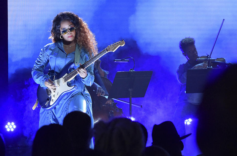 FILE - In this June 24, 2018 file photo, H.E.R. performs at the BET Awards at the Microsoft Theater in Los Angeles. A list of nominees in the top categories at the 2019 Grammys, including Kendrick Lamar, who is the leader with eight nominations, were announced Friday, Dec. 7, 2018, by the Recording Academy. Drake, Cardi B, Brandi Carlile, Childish Gambino, H.E.R., Lady Gaga, Maren Morris, SZA, Kacey Musgraves and Greta Van Fleet also scored multiple nominations. (Photo by Richard Shotwell/Invision/AP, File)