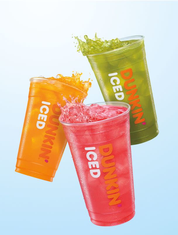 From left to right, Dunkin's new Mango Pineapple, Strawberry Dragon Fruit, and Kiwi Watermelon Refreshers.<p>Dunkin</p>