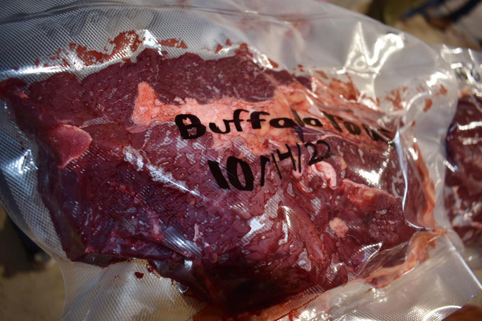 Meat from a buffalo that’s been butchered and packaged is shown at the Wolakota Buffalo Range, on Oct. 14, 2022, near Spring Creek, S.D. More than a dozen people took part in butchering the bison after it was harvested earlier that day. (AP Photo/Matthew Brown)