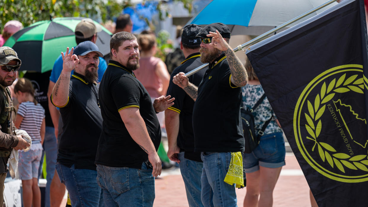 Members of the Kentucky chapter of the Proud Boys display the OK hand signal during the Kentucky Freedom Rally at the capitol building on August 28, 2021 in Frankfort, Kentucky. (Jon Cherry/Getty Images)