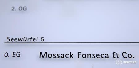 The Mossack Fonseca law firm is shown on a display board in front of an office building in Zurich, Switzerland April 4, 2016. REUTERS/Arnd Wiegmann