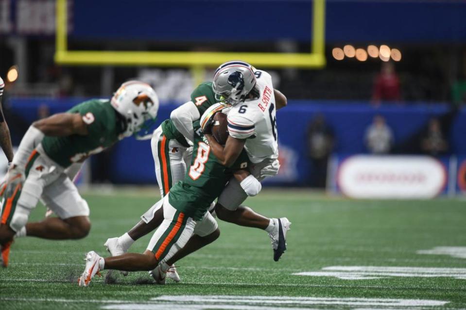 Florida A&M defensive back Eric Smith tackles Howard wide receiver Breylin Smith during the Cricket Celebration Bowl game at Mercedes-Benz Stadium. FAMU defeated Howard 30-26. (Credit: Katie Goodale-USA Today Network)