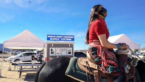 PHOTO: Activist Allie Young, of the Dine, leads a group of Native Americans as they ride on horseback to the polls in Kayenta, Ariz., Oct. 20, 2020.  (Courtesy Talia Mayden)