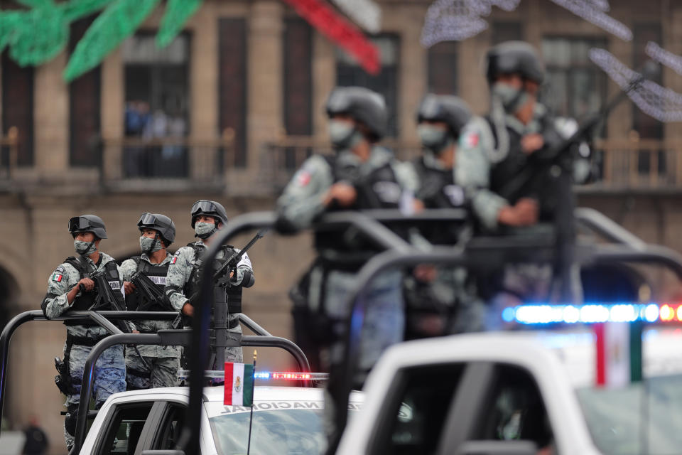 VARIOUS CITIES, MEXICO - SEPTEMBER 16: Soldiers look up towards President Andrés Manuel López Obrador during the Independence Day military parade at Zocalo Square on September 16, 2020 in Various Cities, Mexico. This year El Zocalo remains closed for general public due to coronavirus restrictions. Every September 16 Mexico celebrates the beginning of the revolution uprising of 1810. (Photo by Hector Vivas/Getty Images)