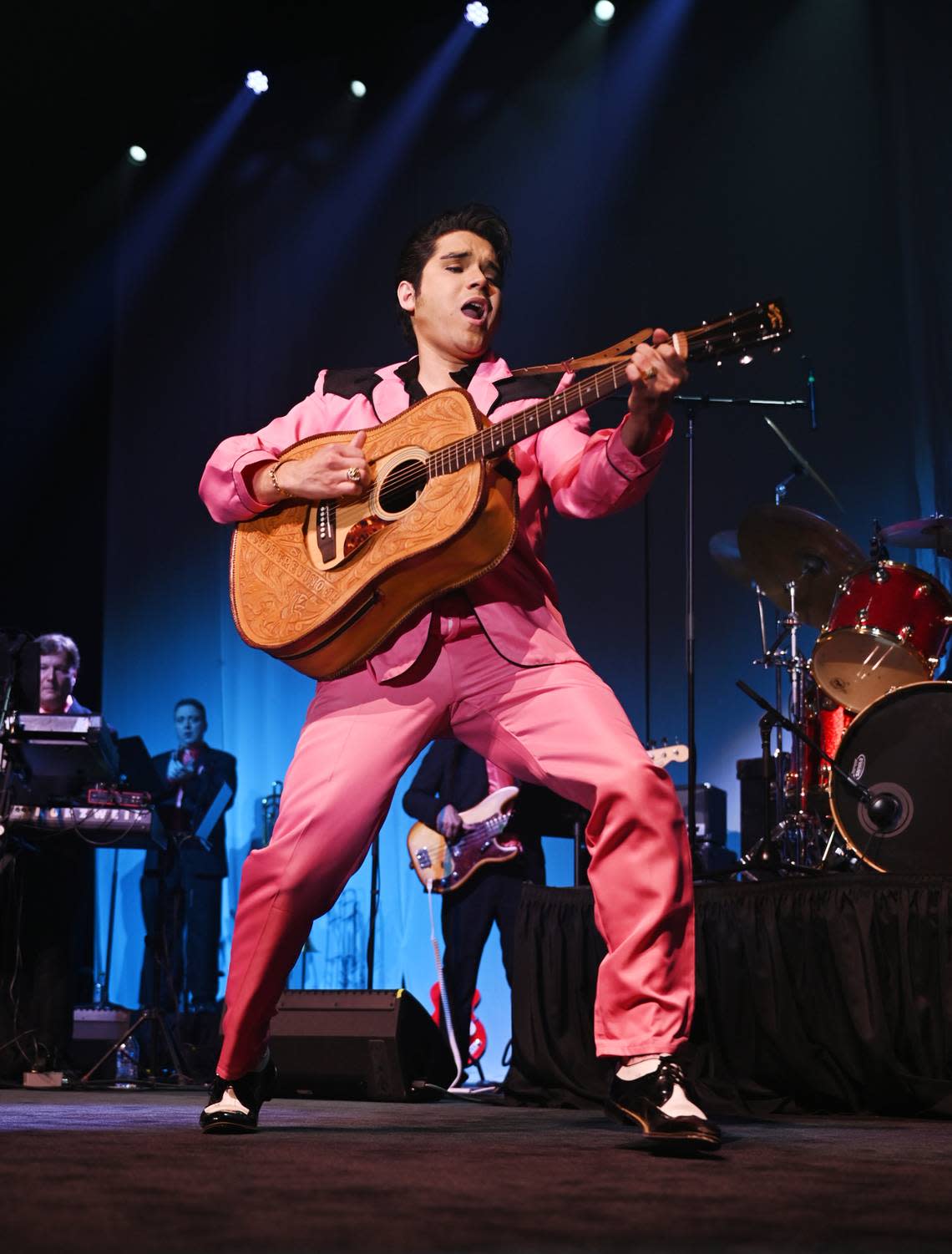 Victor Trevino Jr. performs his Elvis Presley Tribute in a pink and black blazer.