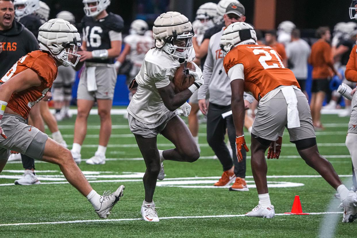 Texas wide receiver Xavier Worthy runs drills during practice at the Superdome on Thursday in New Orleans. The Longhorns will face the Washington Huskies in the Sugar Bowl on Monday.