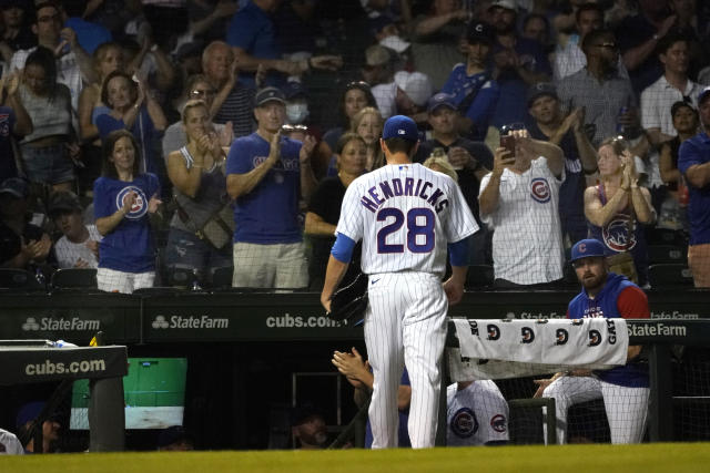 San Diego Padres' Luke Voit watches his three-run double off Chicago Cubs  relief pitcher Mychal Givens during the seventh inning of a baseball game  Tuesday, June 14, 2022, in Chicago. (AP Photo/Charles