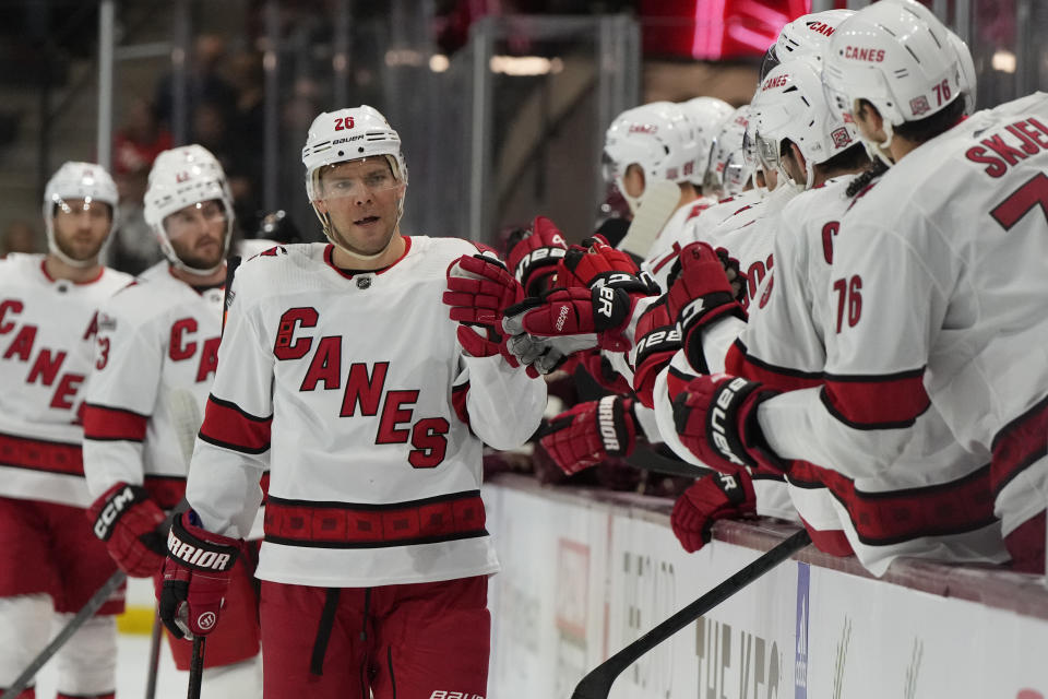 Carolina Hurricanes center Paul Stastny (26) celebrates with teammates after scoring against the Arizona Coyotes in the first period during an NHL hockey game, Friday, March 3, 2023, in Tempe, Ariz. (AP Photo/Rick Scuteri)