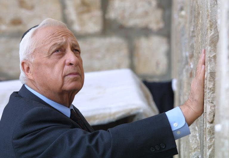 Israeli Prime Minister-elect Ariel Sharon places his hand on the Western Wall, Judaism's holiest site, in the Old City of Jerusalem on February 7, 2001