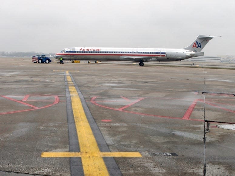 An American Airlines jet is pushed back from its gate as it prepares for take off at Lambert St. Louis International Airport.