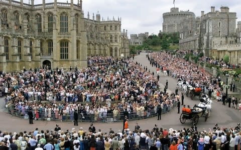 Prince Edward and his bride Sophie Rhys-Jones pass the crowd inside the grounds of Windsor Castle in an open carriage in 1999 - Credit: PA/PA