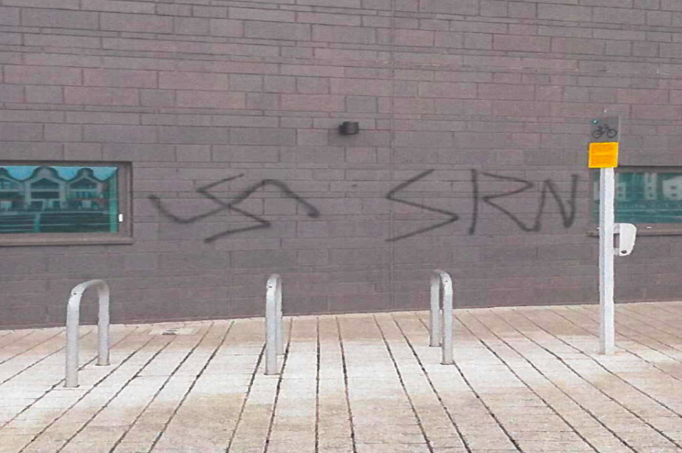 <em>Swastikas and the letters SRN (System Resistance Network) were spray painted on a wall in Newport (PA)</em>