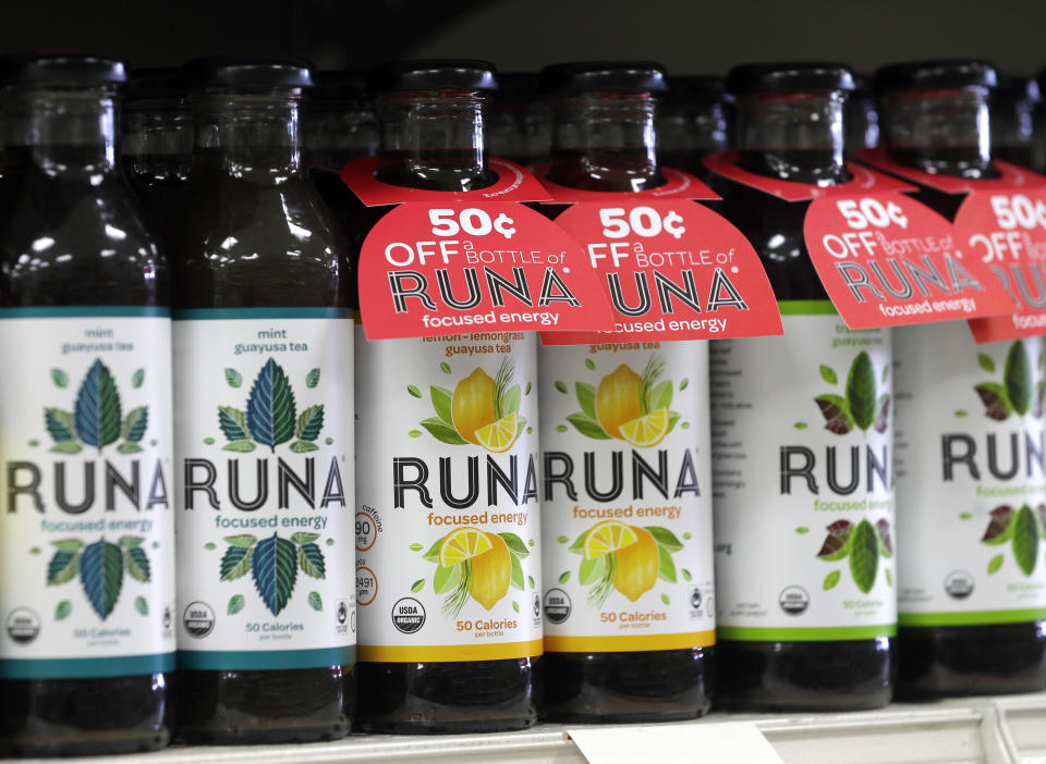 In this Thursday, June 27, 2013 photo, bottles of Runa energy drinks line a shelf at Dean's Natural Foods store in Albany, N.Y. As energy drink sales soar like a caffeine-fueled rocket, more drinks are promoting organic ingredients, added juices, natural caffeine and something called “clean” energy. There's the “natural energy drink” Guru and Steaz Energy, which according to the can is “good for the mind, body and soul.” Or there's Runa's energy drink, made from something called Amazonian guayusa leaves. (AP Photo/Mike Groll)