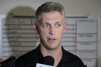 FILE - In this Aug. 1, 2019, file photo, Baltimore Orioles general manager Mike Elias talks to reporters prior to a baseball game against the Toronto Blue Jays, in Baltimore. Hundreds of young baseball players who would usually be celebrating being drafted by major league teams are now in limbo after the Major League Baseball draft was shortened from 40 rounds to five because of the coronavirus pandemic. "It's not ideal, but every team across baseball is being hurt by this on a number of levels," Baltimore Orioles general manager Mike Elias said of the shortened draft. (AP Photo/Julio Cortez, File)