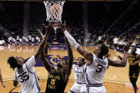 Wichita State center Quincy Ballard (15) competes with Kansas State forwards Nae'Qwan Tomlin (35) and David N'Guessan (3) for a rebound during the first half of an NCAA college basketball game Saturday, Dec. 3, 2022, in Manhattan, Kan. (AP Photo/Charlie Riedel)