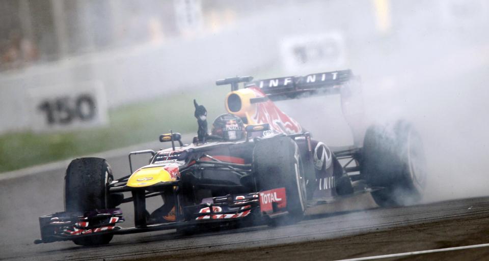 Red Bull Formula One driver Vettel does a burnout to celebrate winning the Indian F1 Grand Prix at the Buddh International Circuit in Greater Noida