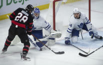 Ottawa Senators right wing Connor Brown prepares to shoot as Toronto Maple Leafs center Auston Matthews attempts to block the shot as goaltender Frederik Andersen is caught out of position during the second period of an NHL hockey game Wednesday, May 12, 2021, in Ottawa, Ontario. Brown scored on the play. (Adrian Wyld/The Canadian Press via AP)