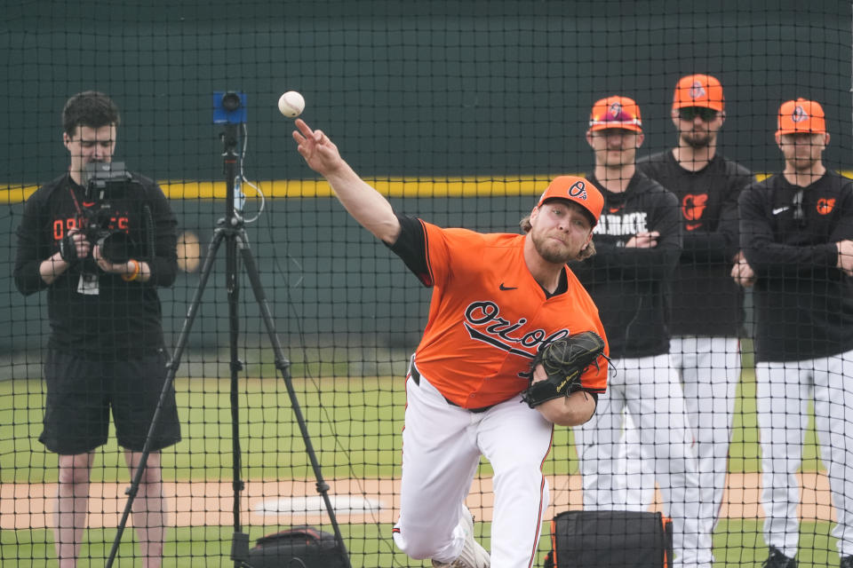 Baltimore Orioles pitcher Corbin Burnes throws during live batting practice at spring training in Sarasota, Fla., Saturday, Feb. 17, 2024. (AP Photo/Gerald Herbert)