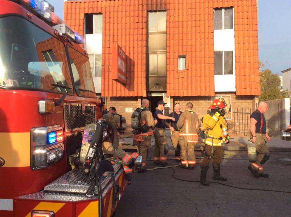 This photo provided by the Las Vegas Fire Department, firefighters work the scene of a fire at a three-story apartment complex early Saturday, Dec. 21, 2019 in Las Vegas.