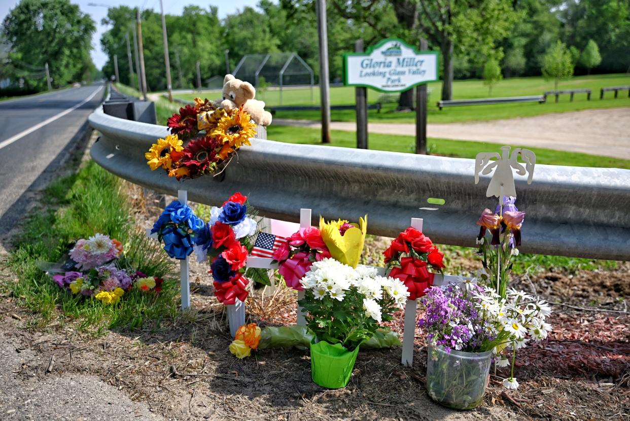 A memorial for those killed and injured on Saturday is displayed at the entrance to the Gloria Miller Looking Glass Valley Park on Monday, May 20, 2024, in Watertown Township.