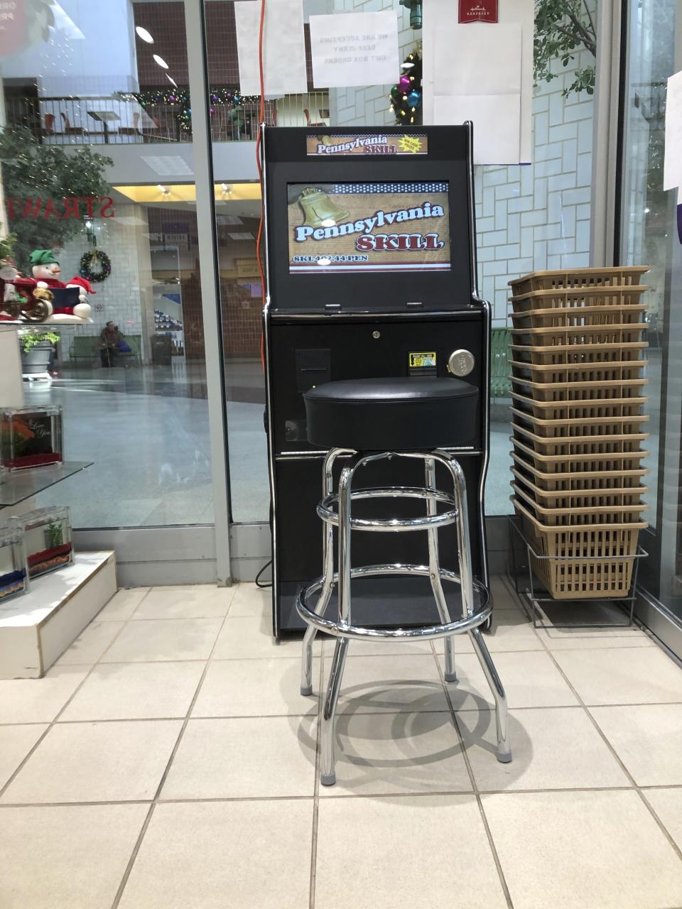 CORRECTS DATE FILE - A Pennsylvania Skill brand electronic game terminal is seen in a greeting card store just across the mall lobby from the entrance to the headquarters of the Pennsylvania attorney general's office, Thursday, Dec. 19, 2019, in Harrisburg, Pa. Pennsylvania's highest court said Tuesday, June 18, 2024, that it will decide whether the cash-paying electronic game terminals that have become commonplace in convenience stores, bars and other businesses are unlicensed gambling machines. (AP Photo/Marc Levy, File)