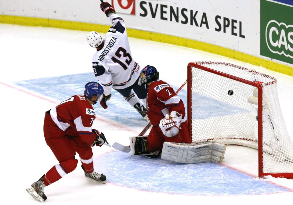 Hinostroza of the U.S. scores on Czech Republic's goalie Dolejs and Sulak during the third period of their IIHF World Junior Championship ice hockey game in Malmo