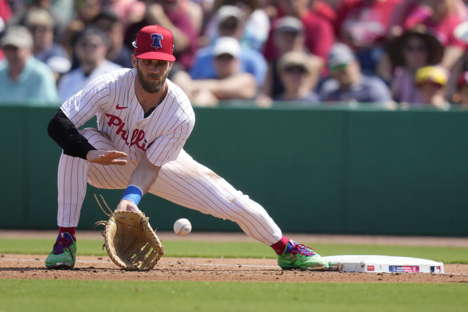 Philadelphia Phillies first baseman Bryce Harper has been dealing with a nagging back injury but says his availability for Opening Day isn't in jeopardy. (AP Photo/Charlie Neibergall)