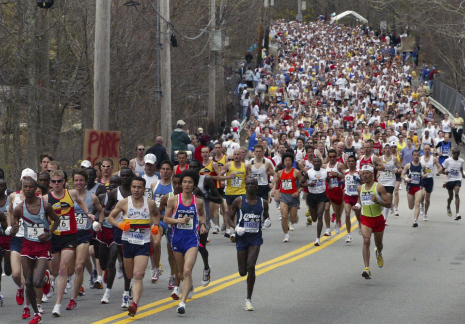 FILE - The 110th Boston Marathon elite runners lead the race, Monday, April 17, 2006, after crossing the start line in Hopkinton, Mass. Once a year for the last 100 years, Hopkinton becomes the center of the running world, thanks to a quirk of geography and history that made it the starting line for the world's oldest and most prestigious annual marathon. (AP Photo/Bizuayehu Tesfaye, File)